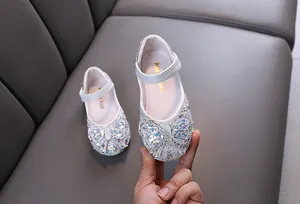 Sparkling rhinestone princess shoes for girls featuring an elegant bow and strap design