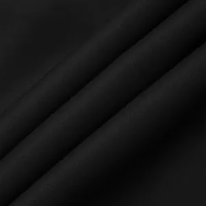 Close-up macro detail of black breathable woven fabric texture for men's oversized casual pants