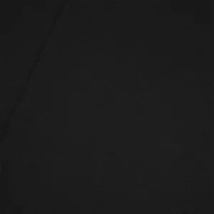 Macro view of black breathable fabric texture on men's casual oversize straight pants