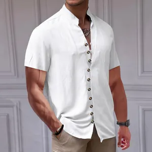 Close-up detail of a men's white linen short-sleeve shirt with stand collar and buttons.