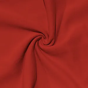 Detailed view showing the soft texture of premium red fabric for men's casual trousers