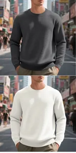 Close-up detail of men's casual crew neck waffle knit sweaters in grey and white colors