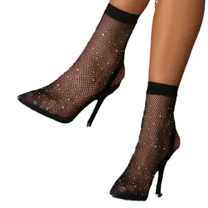 Sexy black fishnet stiletto boots with rhinestone embellishments and pointed toe