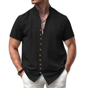 Close-up of vintage black linen shirt with stand collar and wooden buttons for men