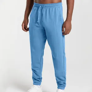 Front view of blue men's loose knit joggers with drawstring waist and cuffed ankles