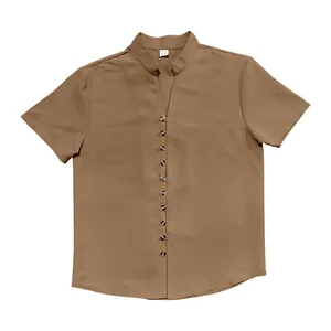 Detail view of men's retro brown linen shirt with stand collar and buttons