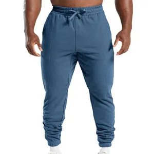 Men's casual blue knitted sweatpants with drawstring waist and tapered cuffed ankles