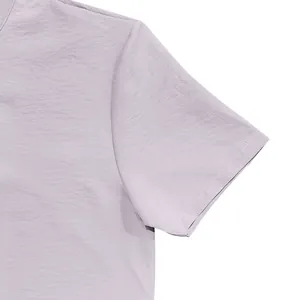 Detail view of lavender men's linen shirt sleeve showing high-quality fabric texture and stitching.