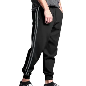 Detail view of men's black joggers with double side stripes and adjustable drawstring