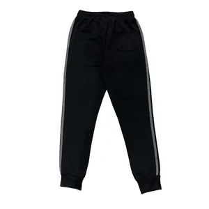 Detailed back view of black men's casual joggers with gray side stripes and pocket
