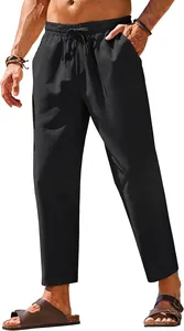 Detail view of men's black linen pants with elastic drawstring waist and straight leg