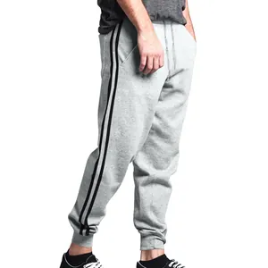 Light gray men's joggers featuring two black side stripes and comfortable drawstring waist