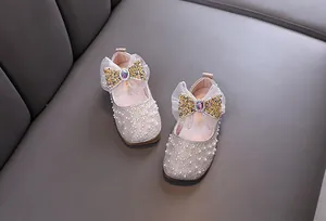 Elegant girls princess flat shoes decorated with shiny pearls and sequin bow ties