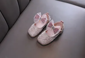Elegant girls pink princess shoes featuring sparkling sequins, large bows and pearl beads