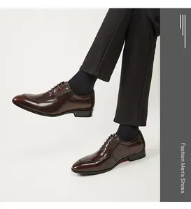 Detailed view of brown genuine leather Oxford shoes for men in a classic business style