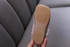Detailed macro view of the anti-slip durable sole for pink girl's rhinestone princess shoes