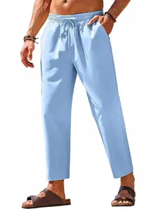 Men's light blue linen casual pants with elastic drawstring waist for summer beach.