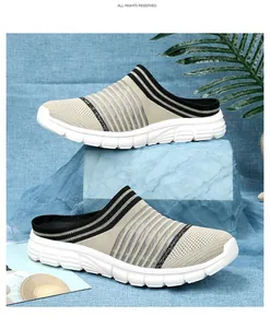Lightweight fly-knit mules with black and beige stripes and a durable white sole.