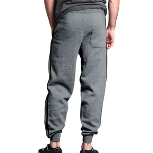 Back view of grey men's joggers featuring side double stripes and a back pocket.