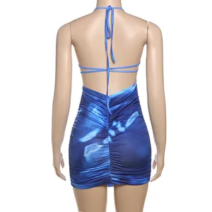 Detailed back view of a blue tie-dye halter mini dress with ruched fabric and open back