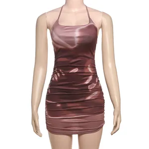 Close-up detail of brown metallic satin ruched fabric on a halter-neck bodycon mini dress