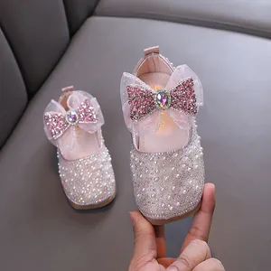 Sparkly pink princess shoes for girls with rhinestone bow and pearls