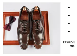 Top-down detailed shot of elegant brown genuine leather Oxford shoes with wooden shoe trees