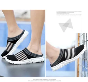 Detail view of breathable fly-knit mesh slip-on casual shoes with striped design