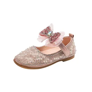 Elegant glittery pink girl's princess shoes with pearls and mesh bow for dance