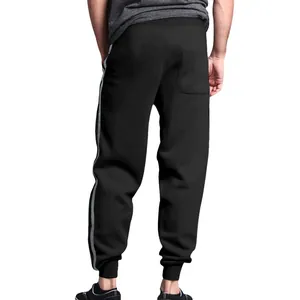 Comfortable men's black cuffed sweatpants featuring stylish double grey side stripes