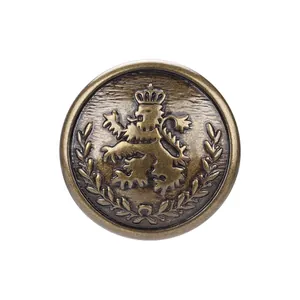 Vintage antique brass metal button featuring a lion crest and crown design for jackets