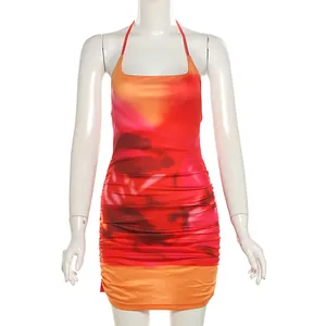 Detailed view of ruched bodycon mini dress with orange red gradient halter neck