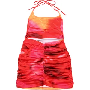 Detailed back view of vibrant red and orange tie-dye ruched bodycon halter dress.