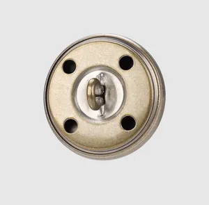 Macro view showing the durable shank back of a vintage-style brass metal garment button