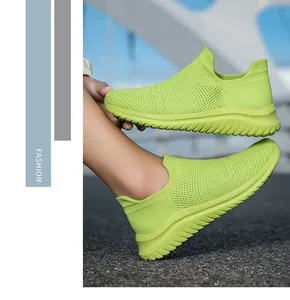 Vibrant neon green flying weave mesh slip-on sneakers with breathable texture
