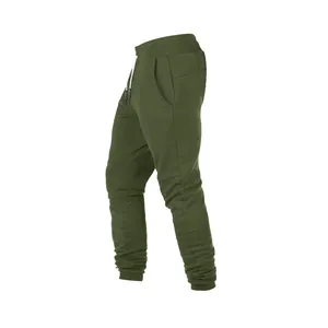 Vista lateral de pantalones deportivos verde oliva para hombre para fitness y correr