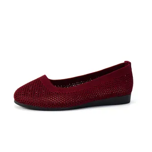 Women's burgundy fly-woven flat shoes with breathable mesh and round toe design.