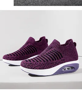 Macro view of purple fly-knit breathable slip-on walking shoes with a comfortable air cushion sole