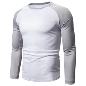 Close-up of men's long-sleeve raglan t-shirt with grey sleeves and white body design.