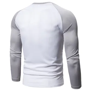 Back view of a men's color-blocked long sleeve t-shirt with white and grey raglan sleeves.