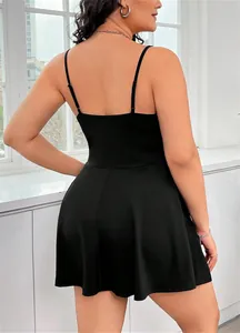 Detail view showing the back of a plus size black spaghetti strap backless dress