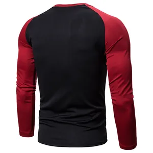Back view of a men's slim fit raglan long sleeve t-shirt featuring black and red color block design
