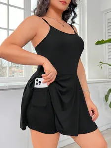 Close-up detail of a black plus size cami dress featuring a functional side pocket