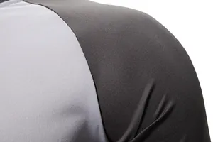 Close-up detail of sporty color-block fabric texture and shoulder seam on men's t-shirt