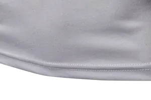 Close-up detail of high-quality double-stitched hemline on a grey long-sleeved men's t-shirt