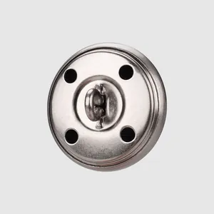 High-end brass metal button with back shank and four-hole detail for premium garments.