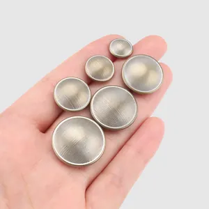 Premium antique brass metal buttons with fine ribbed texture for luxury suits and coats