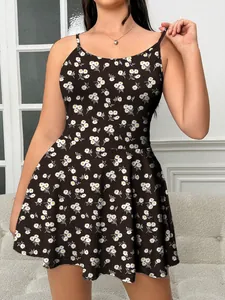 Detailed view of plus-size black camisole dress with white daisy floral print