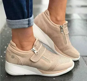 Comfortable beige wedge sneakers for women featuring sparkling rhinestones and velcro strap
