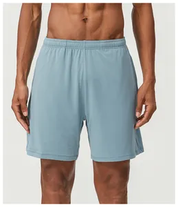 Close-up of men's light blue breathable mesh sports shorts for running and gym workouts.